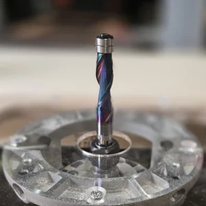 1/2" up-cut flush trim router bit in router table.